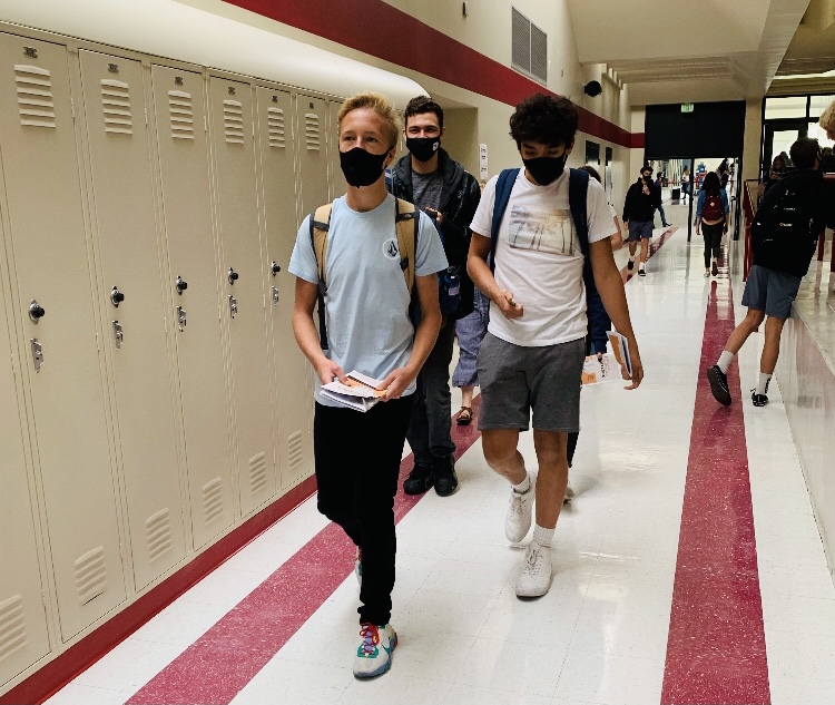 MVHS students wearing their masks and walking through the halls during transition time.
