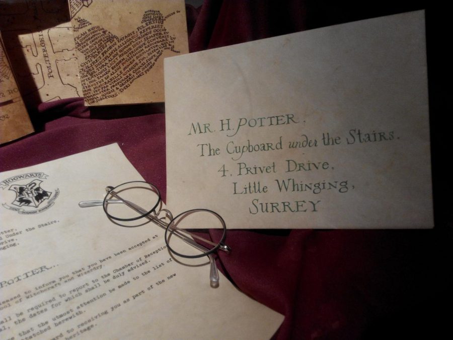 Harry Potter letter, glasses, and map.