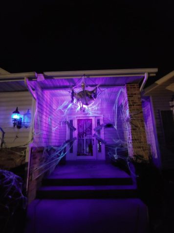 Complete Halloween Decorations at night with black lights turned on.