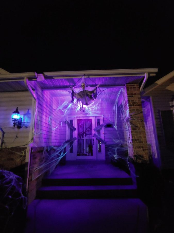 Complete+Halloween+Decorations+at+night+with+black+lights+turned+on.