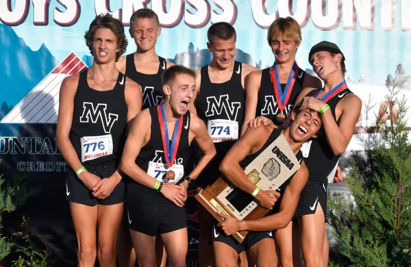 Mountain View boys cross country as they receive the trophy for taking state.